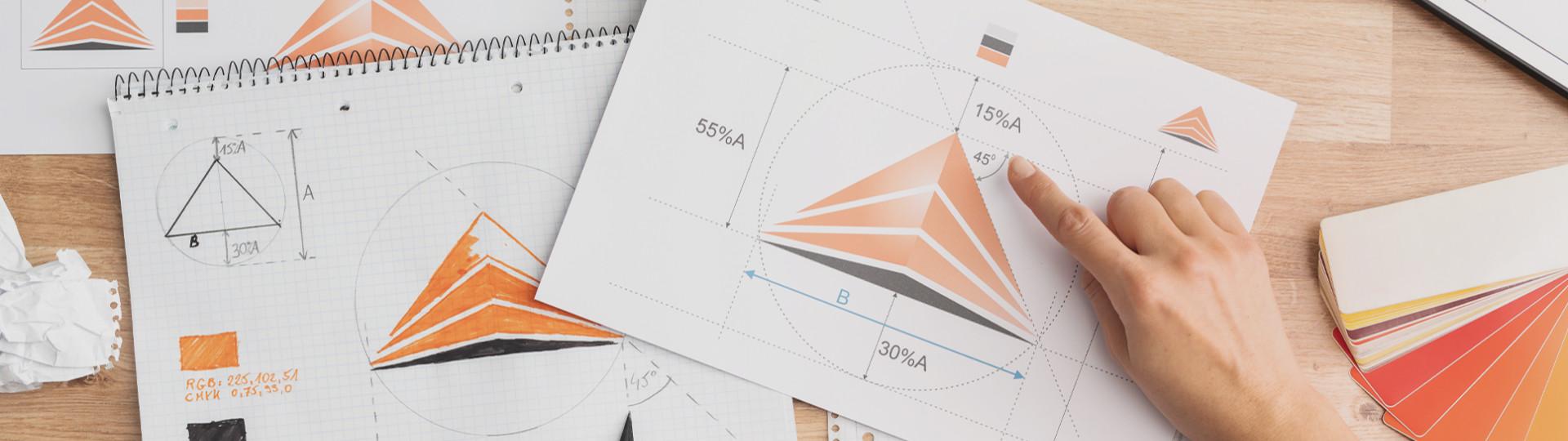 a desk full of printed designs